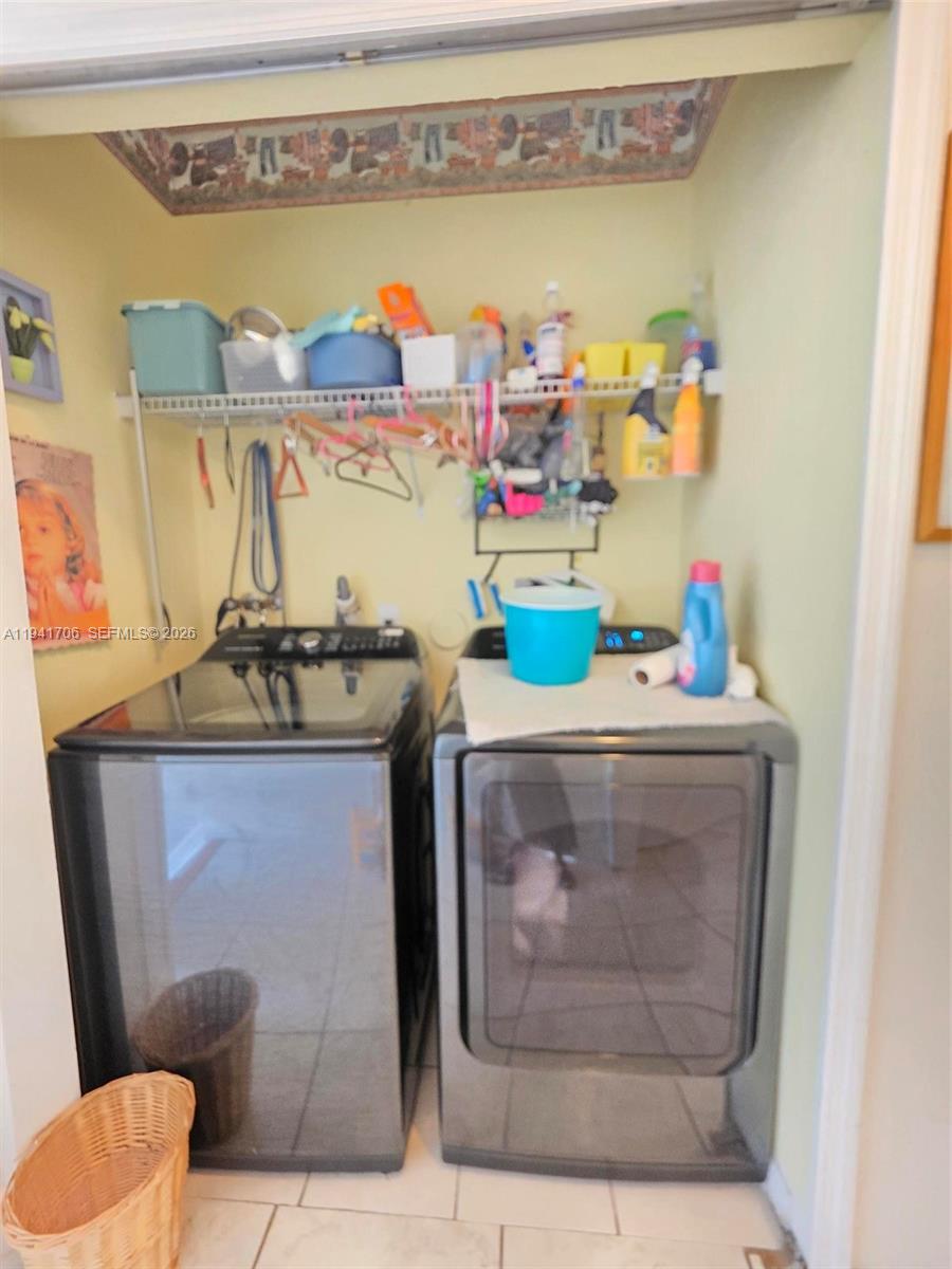 11702 Southwest 137th Place Miami, FL 33186 - Photo 26 of 30 a utility room with dryer and washer
