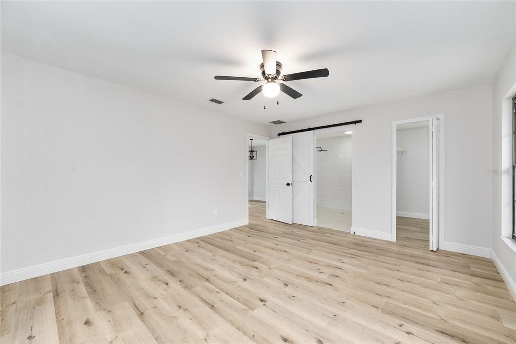 320 Southeast 41st Avenue Ocala, FL 34471 - Photo 13 of 45 a view of empty room with wooden floor and ceiling fan