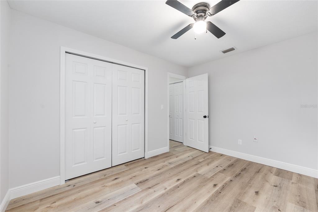 320 Southeast 41st Avenue Ocala, FL 34471 - Photo 26 of 45 wooden floor in an empty room