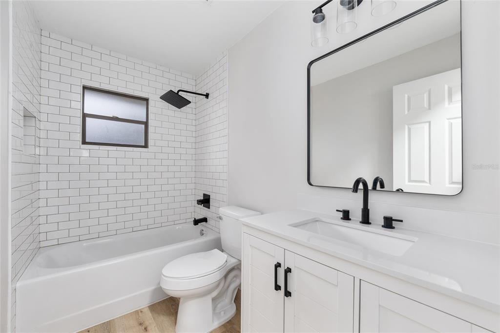 320 Southeast 41st Avenue Ocala, FL 34471 - Photo 27 of 45 a bathroom with a sink a toilet and shower