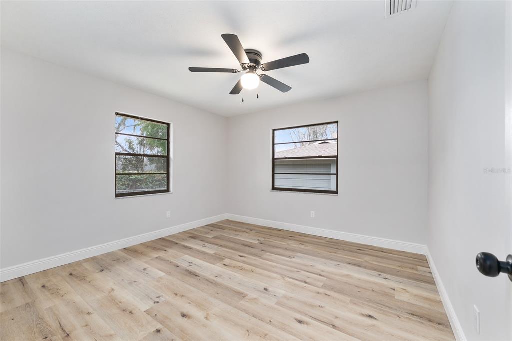 320 Southeast 41st Avenue Ocala, FL 34471 - Photo 28 of 45 a view of a ceiling fan with wooden floor