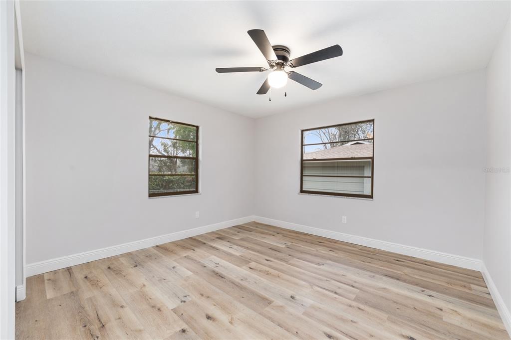 320 Southeast 41st Avenue Ocala, FL 34471 - Photo 29 of 45 a view of a big room with wooden floor closet and windows