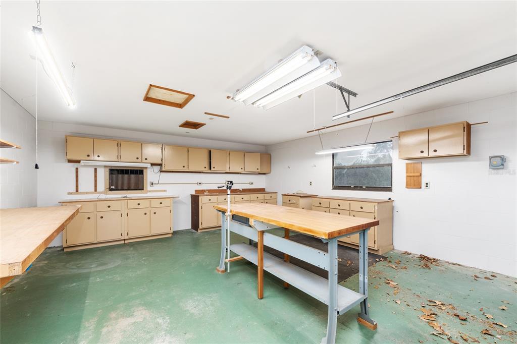 320 Southeast 41st Avenue Ocala, FL 34471 - Photo 41 of 45 a large kitchen with a large counter space and stainless steel appliances