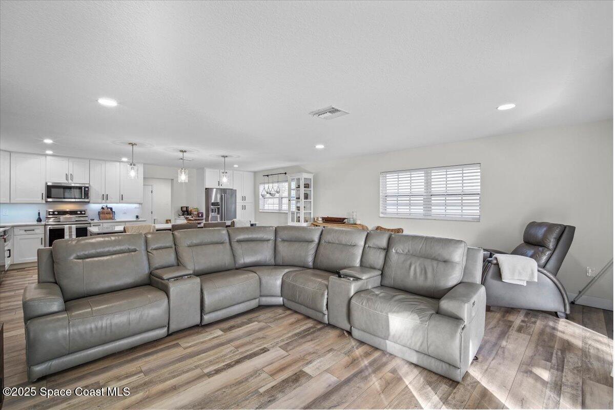 1158 Samar Road Cocoa Beach, FL 32931 - Photo 13 of 29 a living room with furniture and a couch