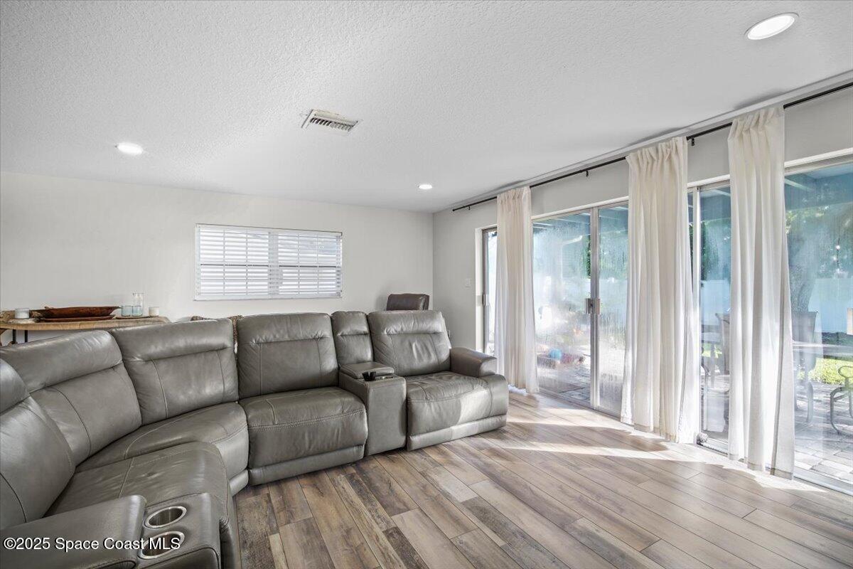 1158 Samar Road Cocoa Beach, FL 32931 - Photo 14 of 29 a living room with furniture and a window