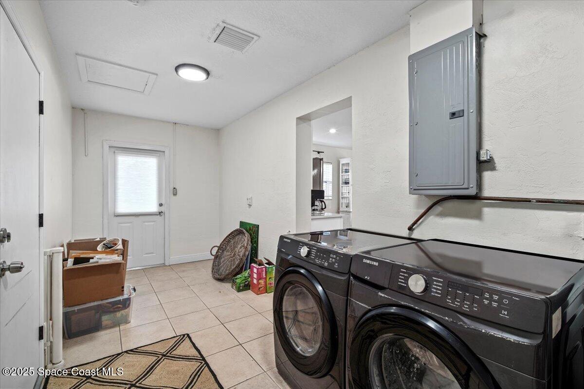 1158 Samar Road Cocoa Beach, FL 32931 - Photo 16 of 29 a utility room with dryer and washer