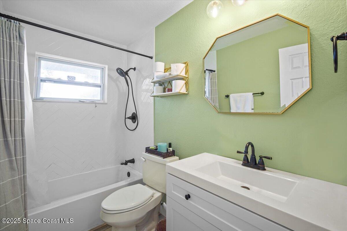 1158 Samar Road Cocoa Beach, FL 32931 - Photo 23 of 29 a bathroom with a sink toilet and shower