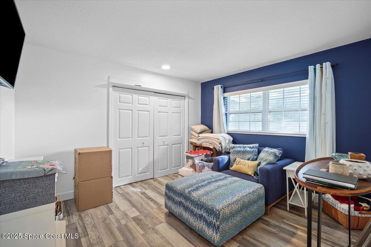 1158 Samar Road Cocoa Beach, FL 32931 - Photo 24 of 29 a bedroom with furniture and a window
