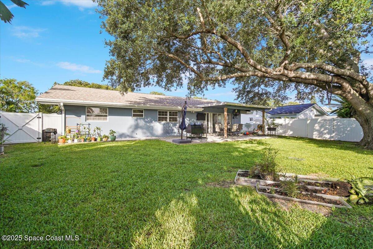 1158 Samar Road Cocoa Beach, FL 32931 - Photo 27 of 29 a view of a house with a yard patio and swimming pool