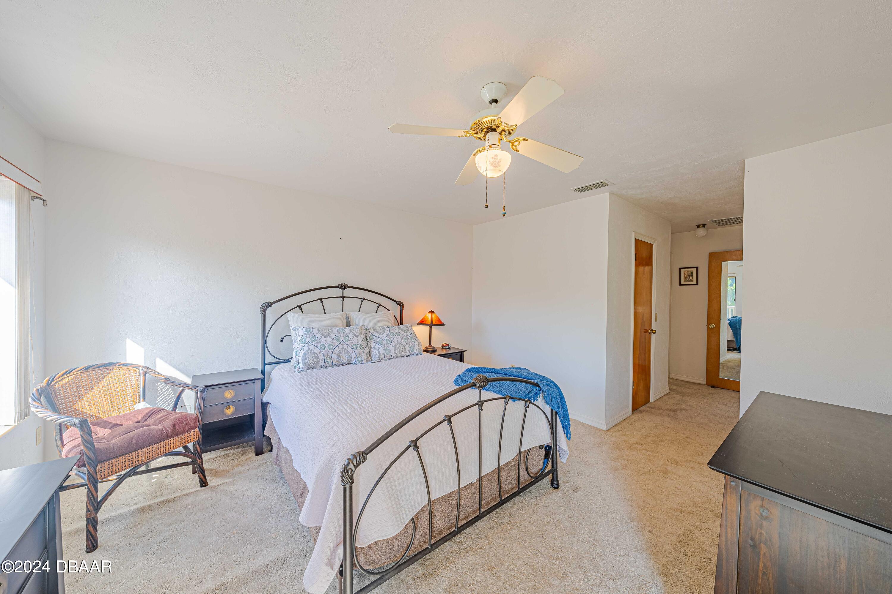 42 Jana Drive Ponce Inlet, FL 32127 - Photo 25 of 34 a view of a bedroom and bedroom