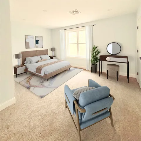 a bedroom with a bed couch and window