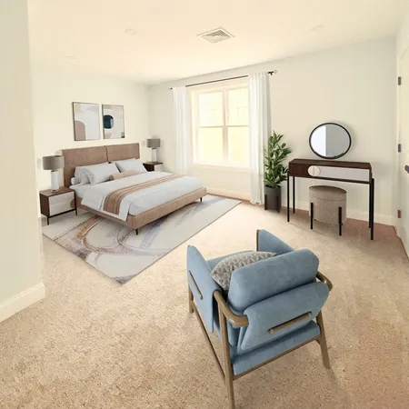 a bedroom with a bed couch and window