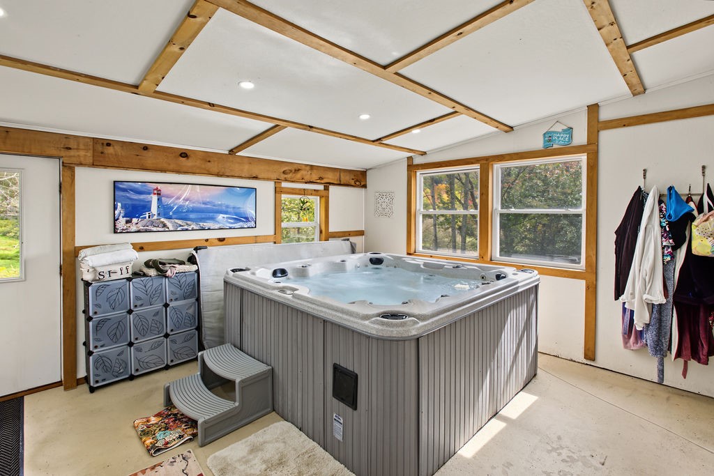 1668 Vandervort Hill Road Unadilla, NY 13849 - Photo 30 of 50 Exposed wood beams and a large hot tub define this versatile indoor spa room.