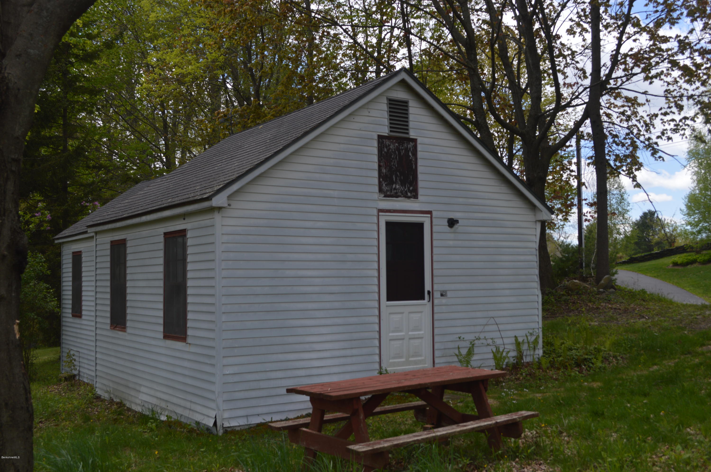 374 W Road Lee, MA 01238 - Photo 6 of 15 a front view of a house with garden