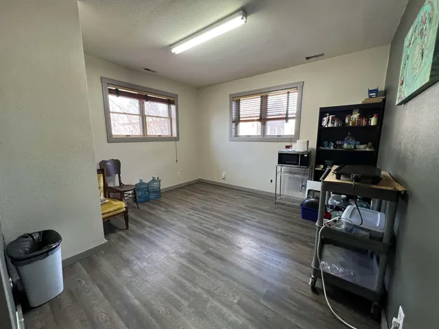 a view of hallway with mirror and a window