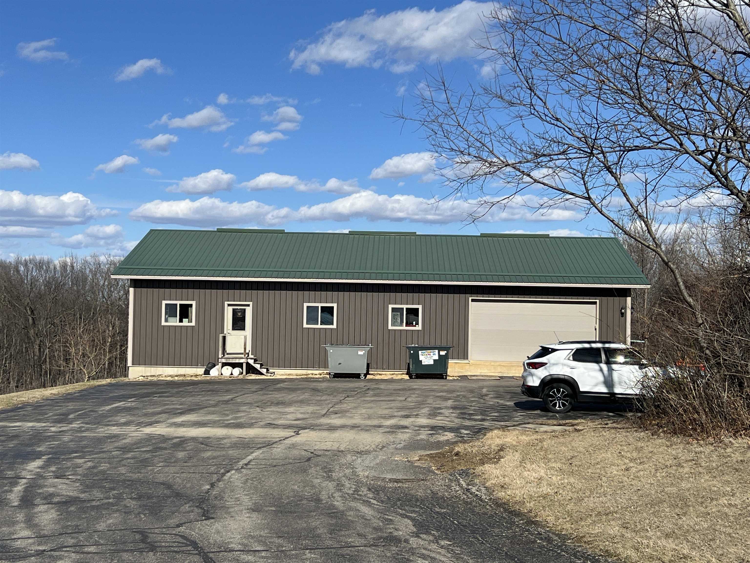 5140 Highway 20 Galena, IL 61036 - Photo 20 of 38 a front view of a house with cars parked