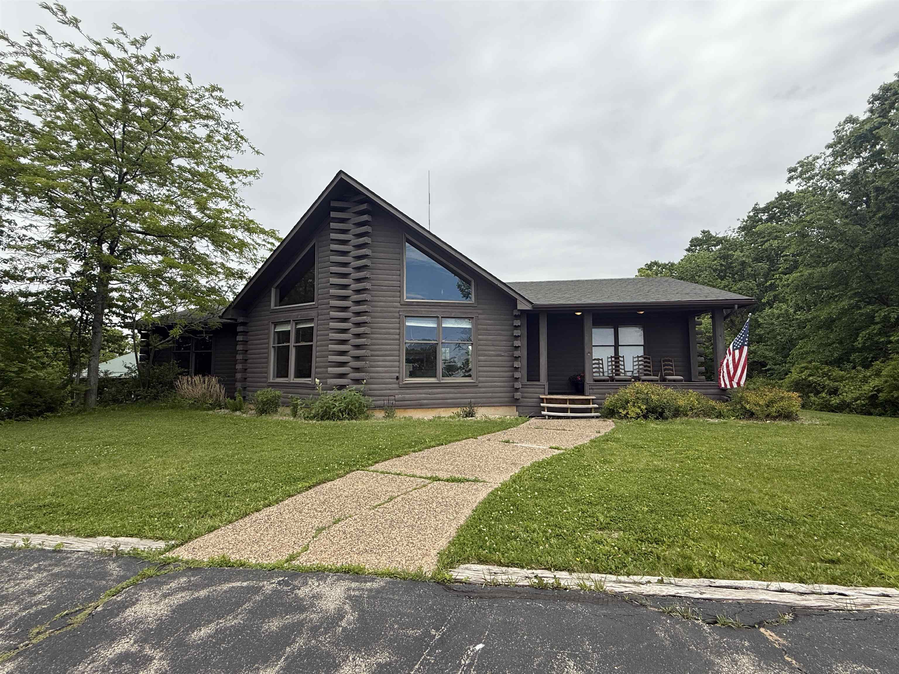 5140 Highway 20 Galena, IL 61036 - Photo 2 of 38 a front view of a house with a yard and garage