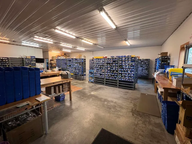 a kitchen with stainless steel appliances granite countertop a refrigerator and a stove