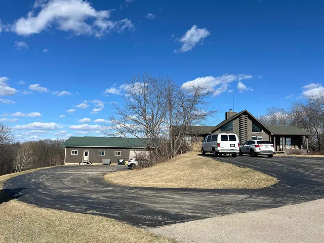 a view of a big house with a big yard