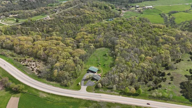 a view of a grassy field with trees
