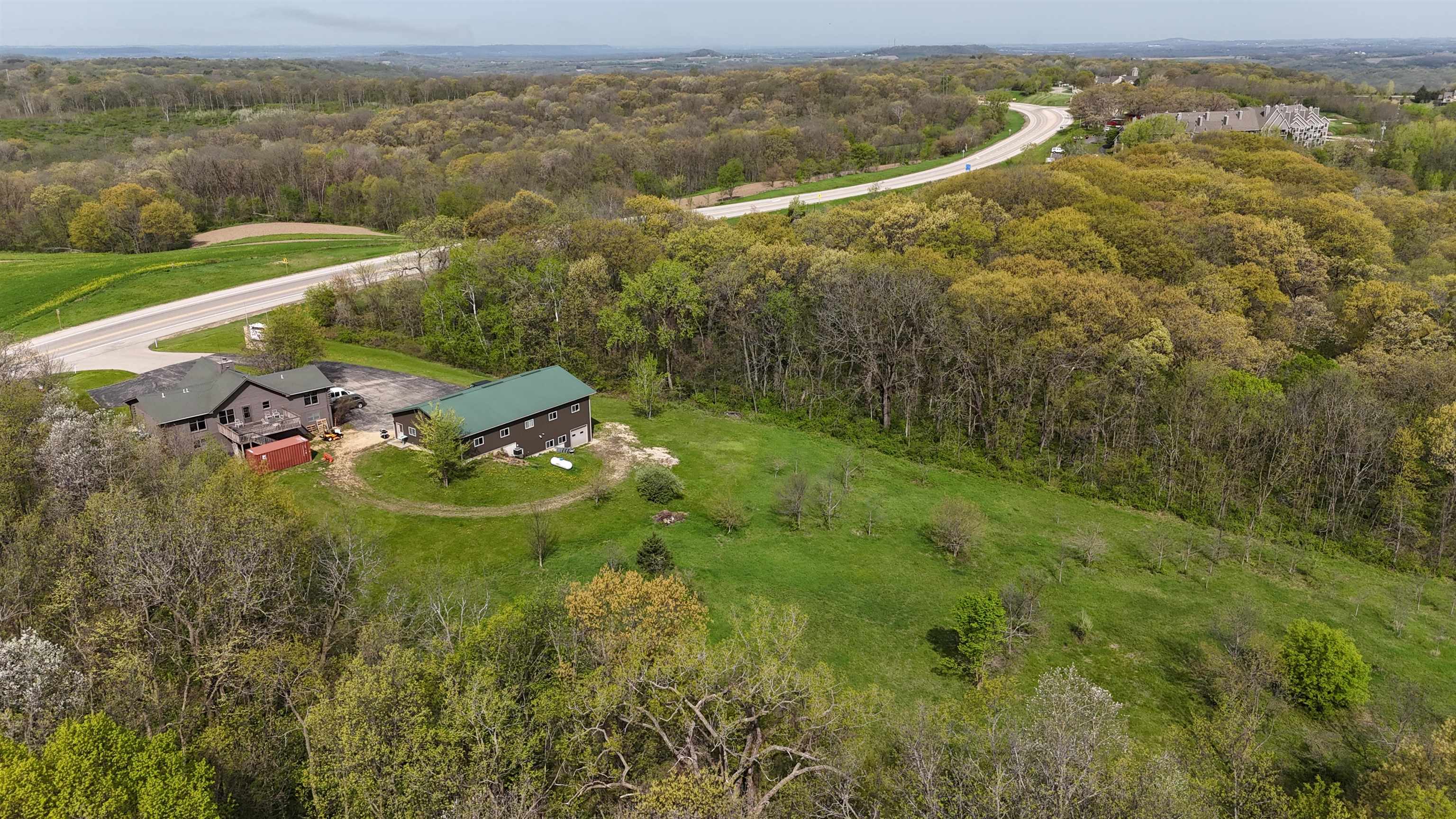 5140 Highway 20 Galena, IL 61036 - Photo 37 of 38 an aerial view of residential houses with outdoor space and trees