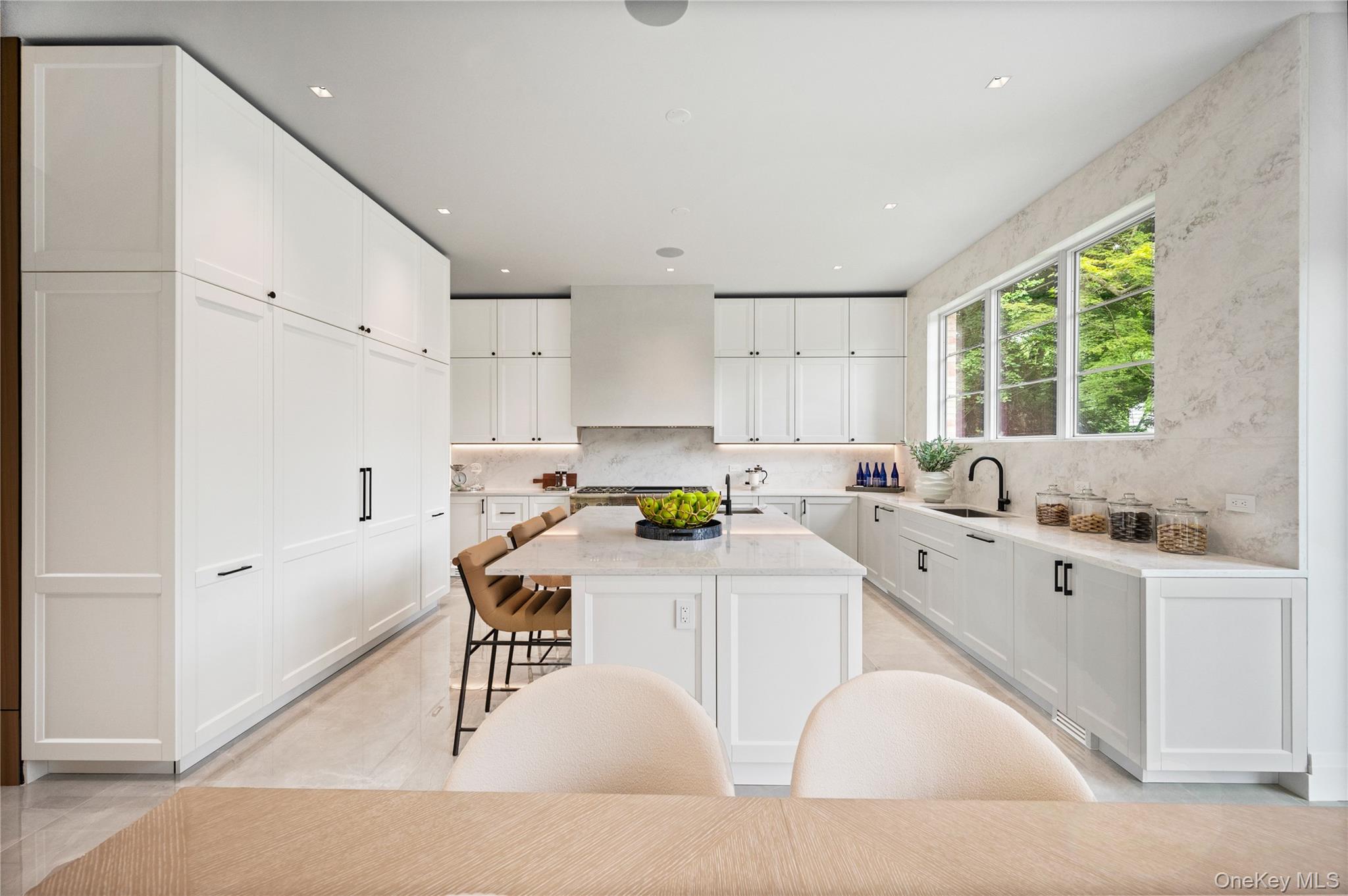 7 Mirrielees Road Great Neck, NY 11021 - Photo 14 of 47 a kitchen with a sink a window and stainless steel appliances
