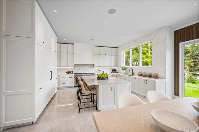 a kitchen with counter space appliances and a window