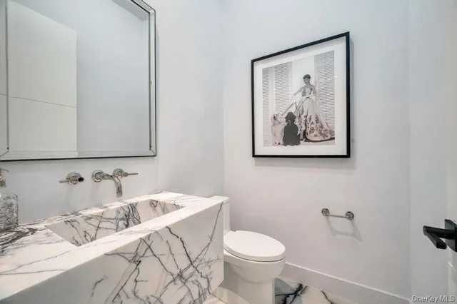a bathroom with a sink and a toilet