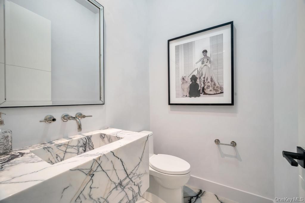 7 Mirrielees Road Great Neck, NY 11021 - Photo 17 of 47 a bathroom with a sink and a toilet