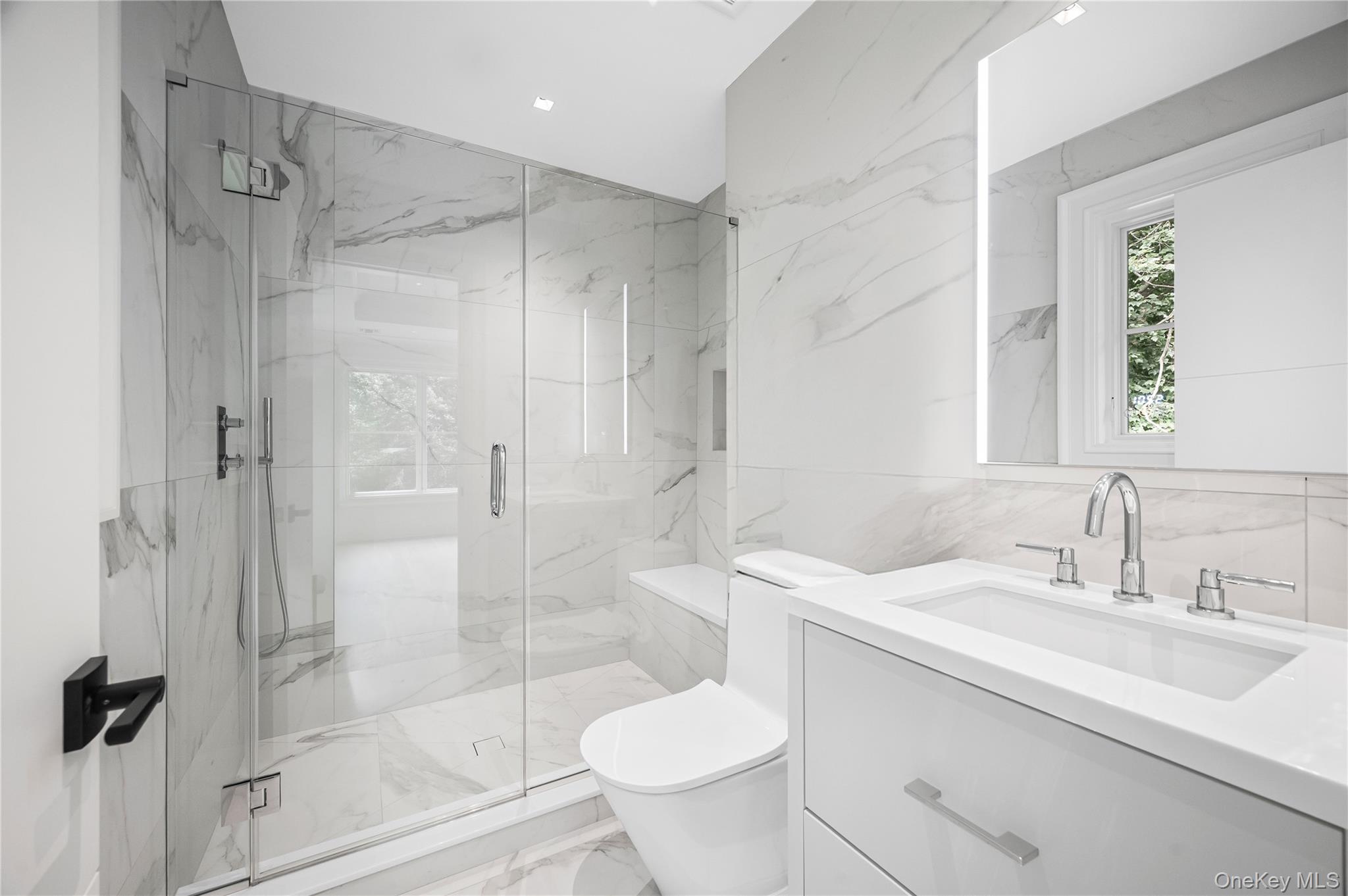 7 Mirrielees Road Great Neck, NY 11021 - Photo 25 of 47 a bathroom with a sink toilet and shower