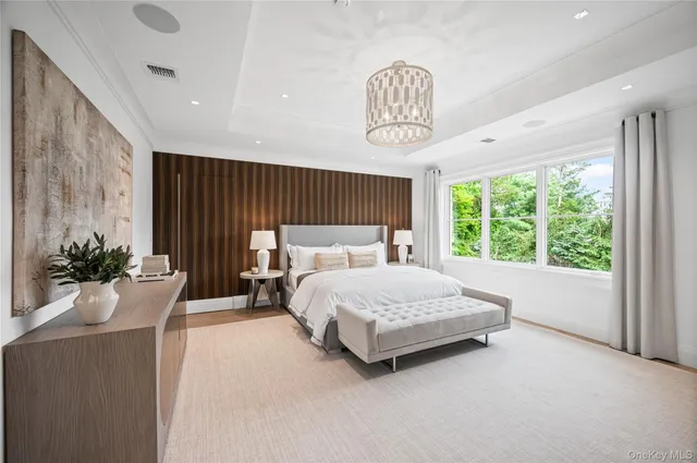 a bedroom with furniture and a fireplace