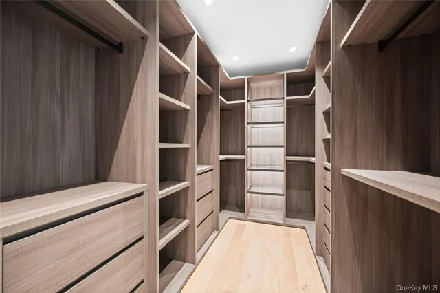 a bathroom with double sink and a mirror