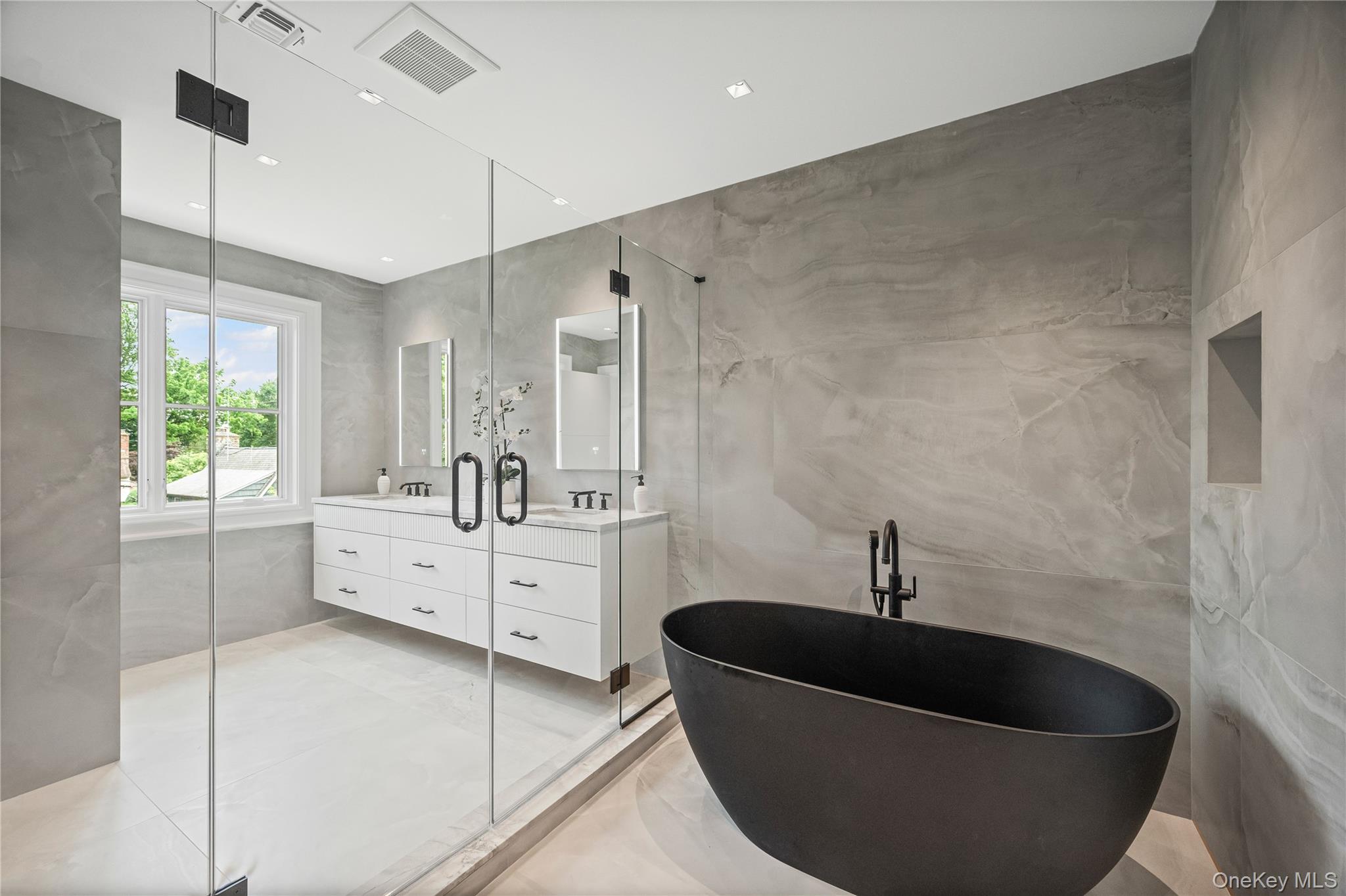 7 Mirrielees Road Great Neck, NY 11021 - Photo 38 of 47 a living room with furniture and a bathtub