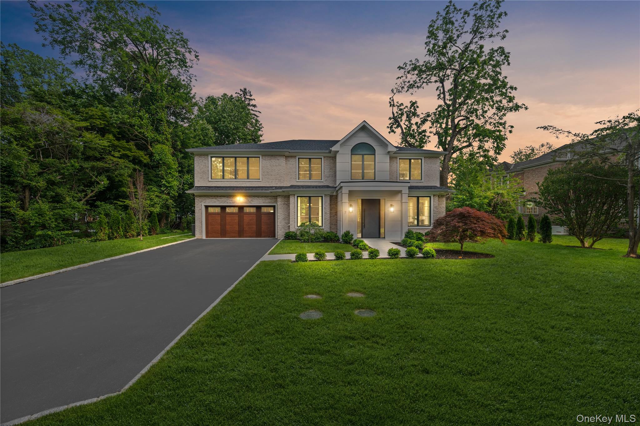 7 Mirrielees Road Great Neck, NY 11021 - Photo 47 of 47 a front view of a house with a yard