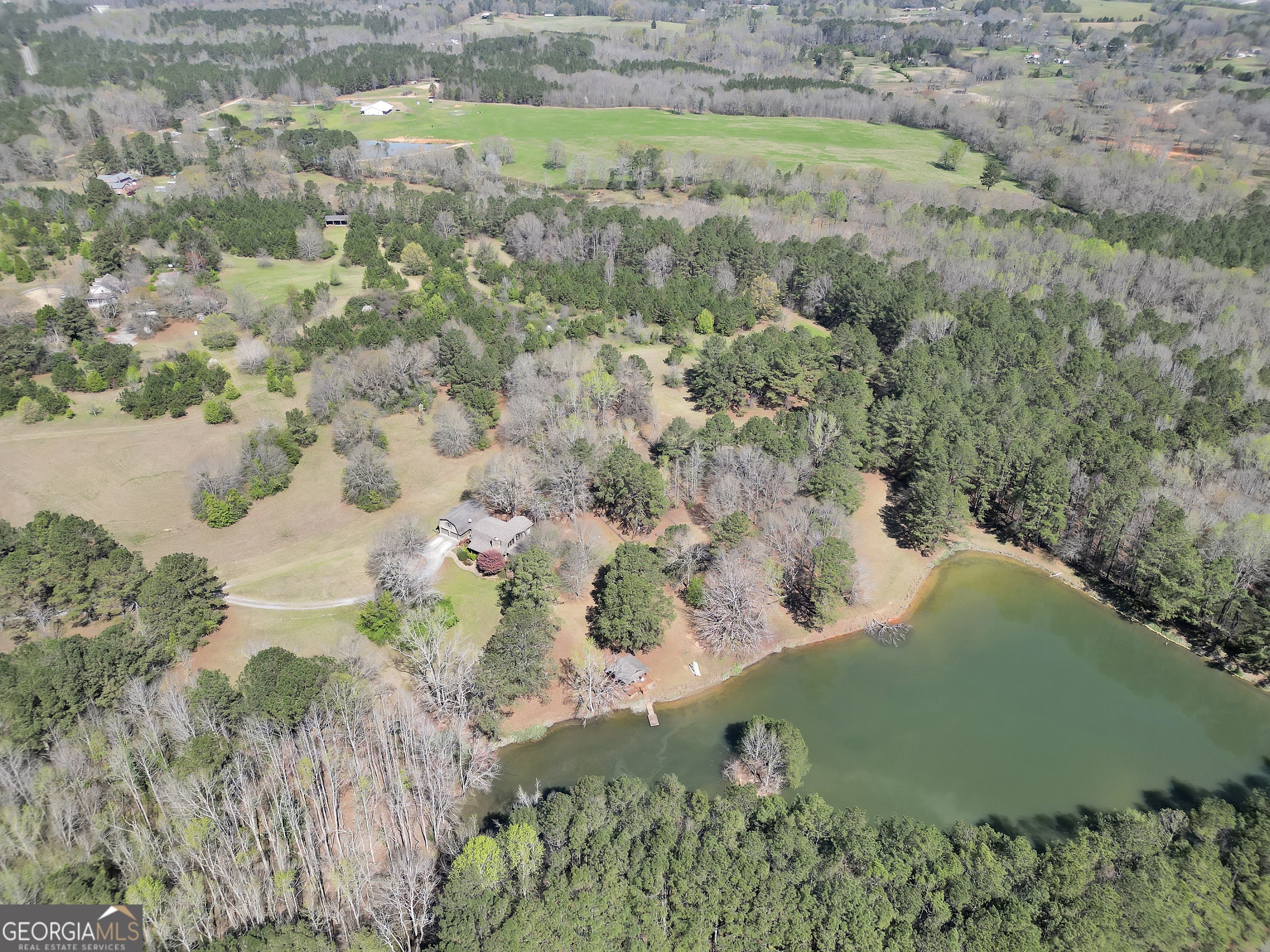 330 Country Kitchen Road Barnesville, GA 30204 - Photo 59 of 64 a view of a lake with a yard