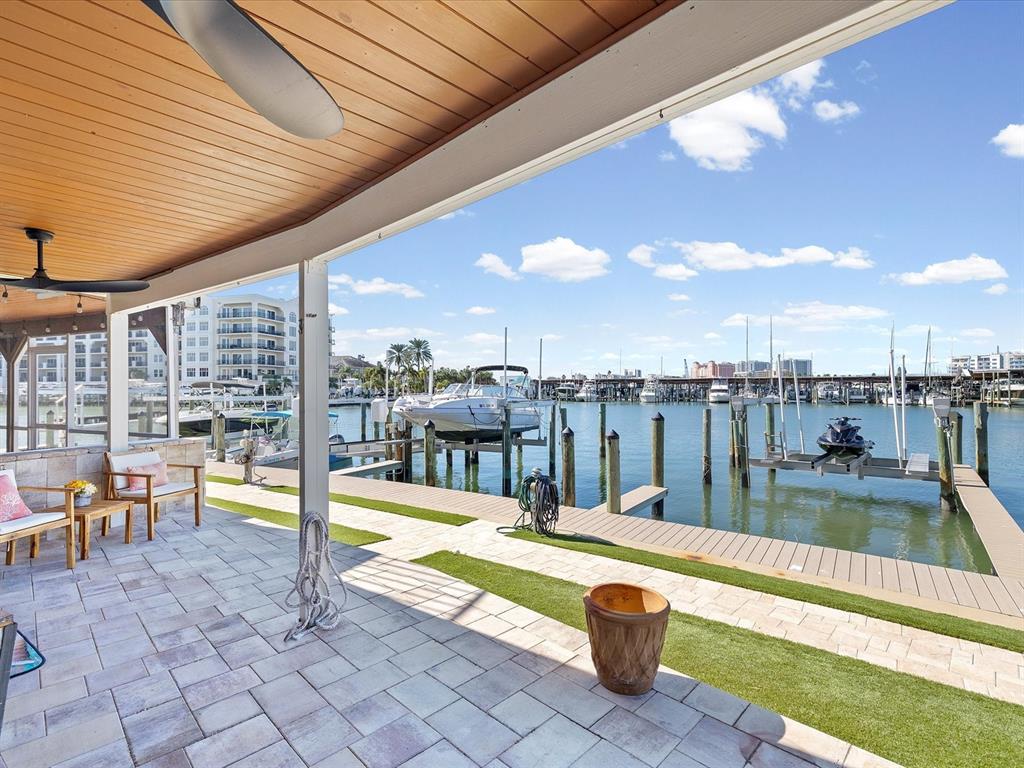 205 Dolphin Point, Unit 4 Clearwater Beach, FL 33767 - Photo 18 of 23 a view of swimming pool with seating area and furniture