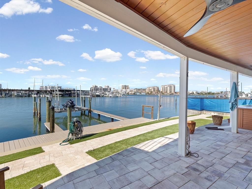 205 Dolphin Point, Unit 4 Clearwater Beach, FL 33767 - Photo 2 of 23 a view of swimming pool with a lounge chair
