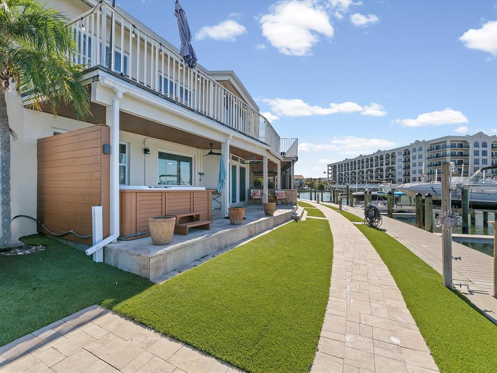 205 Dolphin Point, Unit 4 Clearwater Beach, FL 33767 - Photo 21 of 23 a view of a house with a swimming pool