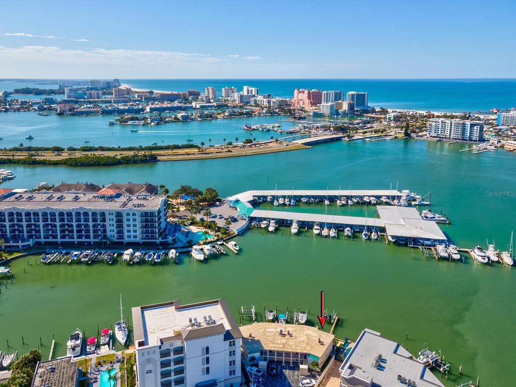 205 Dolphin Point, Unit 4 Clearwater Beach, FL 33767 - Photo 4 of 23 an aerial view of a house with a lake view