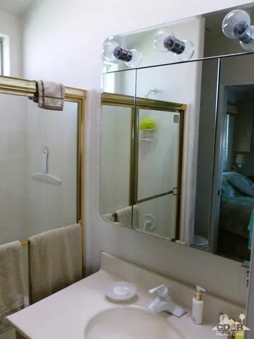 a bathroom with a sink and shower