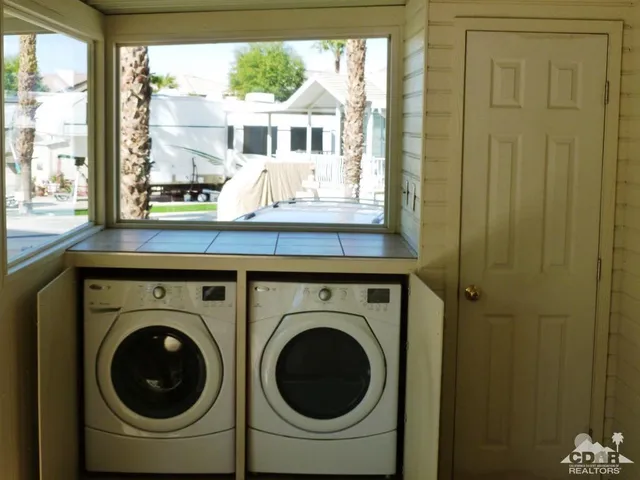a utility room with dryer and washer