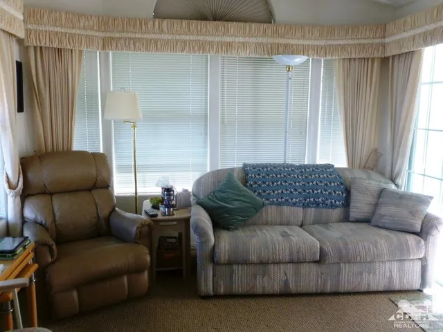 a living room with furniture and a couch