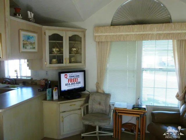 a view of a livingroom with furniture and window