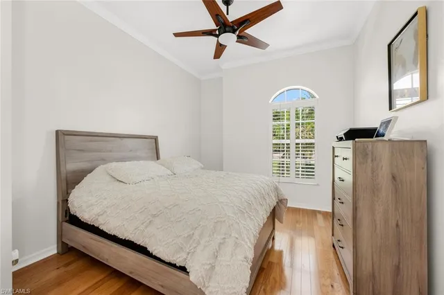 a bedroom with a bed dresser and a window