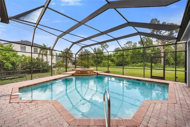 a view of a swimming pool with a patio