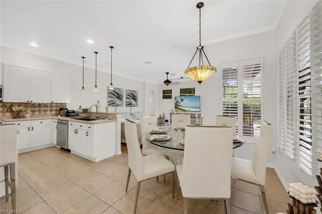 a kitchen that has a lot of cabinets in it