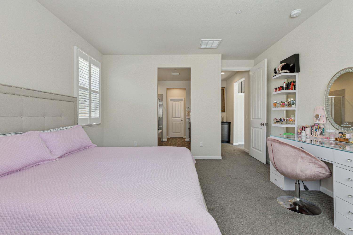 3264 Showcase Way Modesto, CA 95356 - Photo 11 of 31 a bedroom with a bed a table and chair