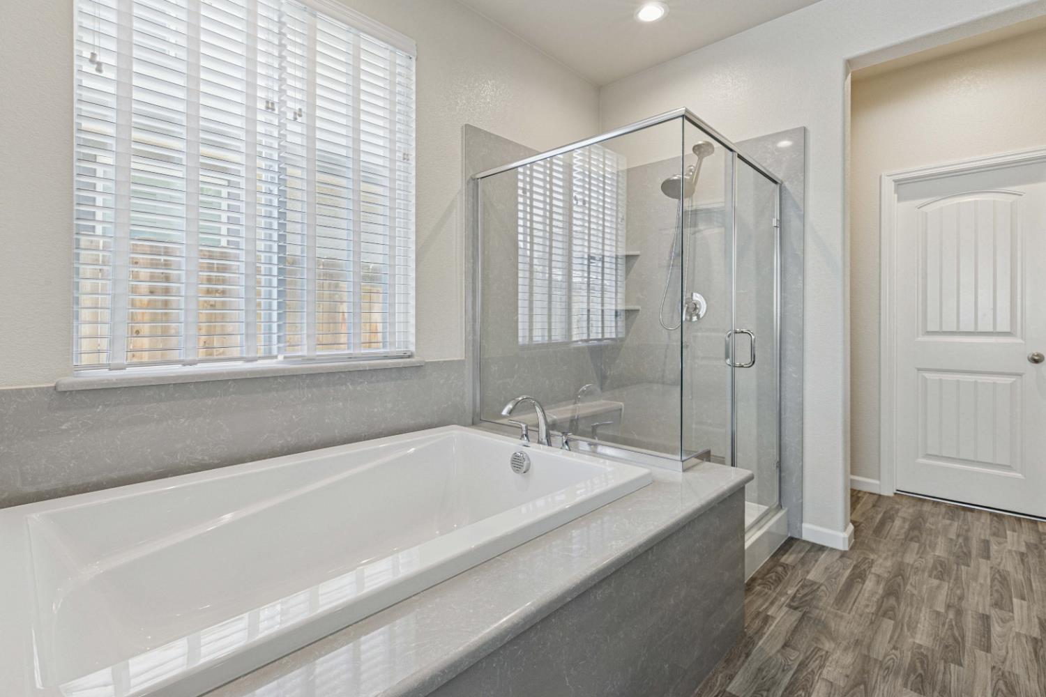 3264 Showcase Way Modesto, CA 95356 - Photo 13 of 31 a spacious bathroom with a bathtub and shower