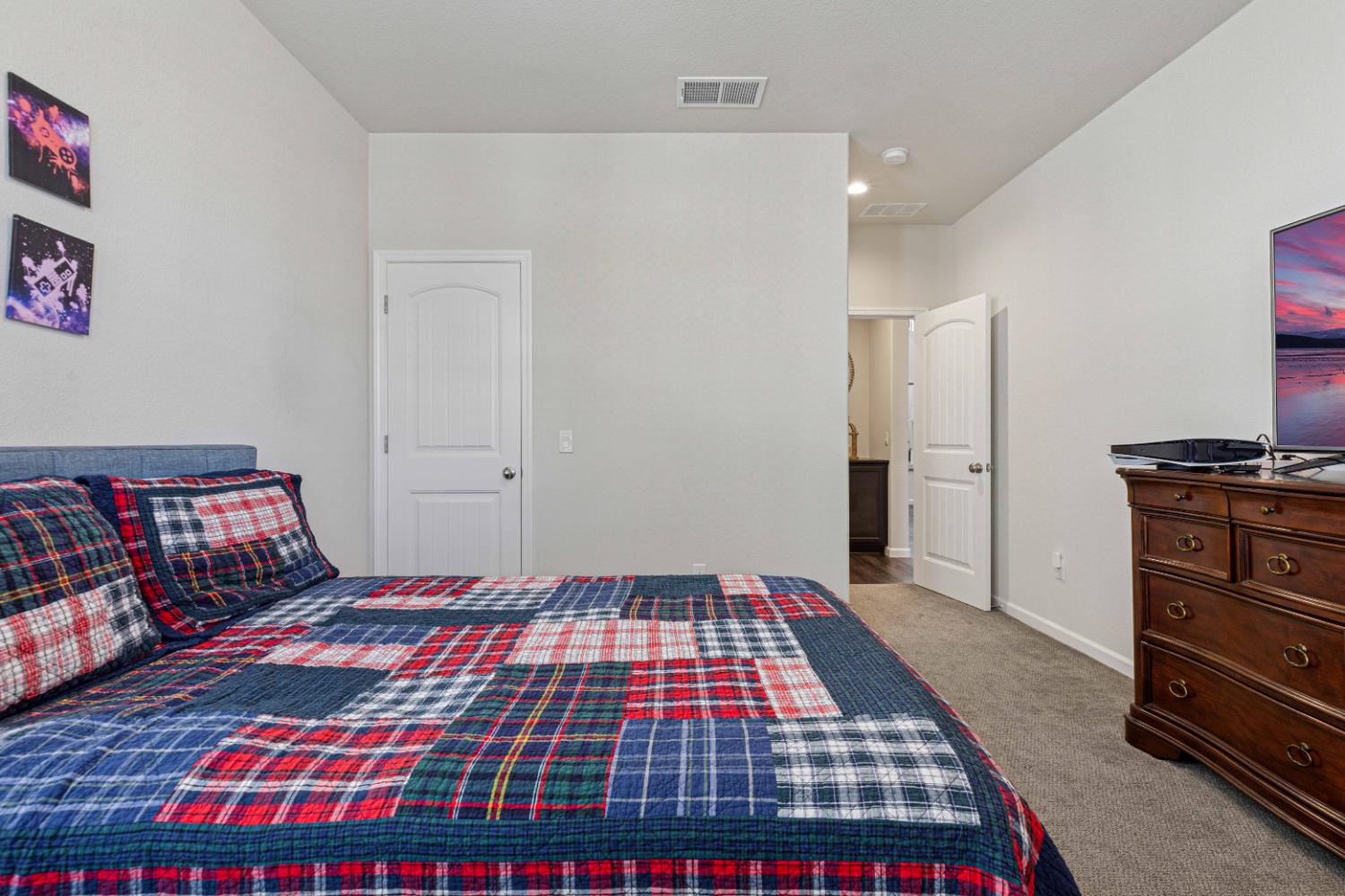 3264 Showcase Way Modesto, CA 95356 - Photo 15 of 31 a bedroom with a bed and a dresser