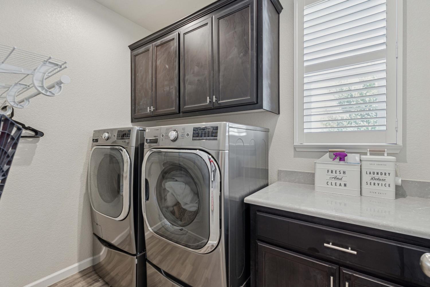 3264 Showcase Way Modesto, CA 95356 - Photo 23 of 31 a view of a storage and utility room with washer and dryer